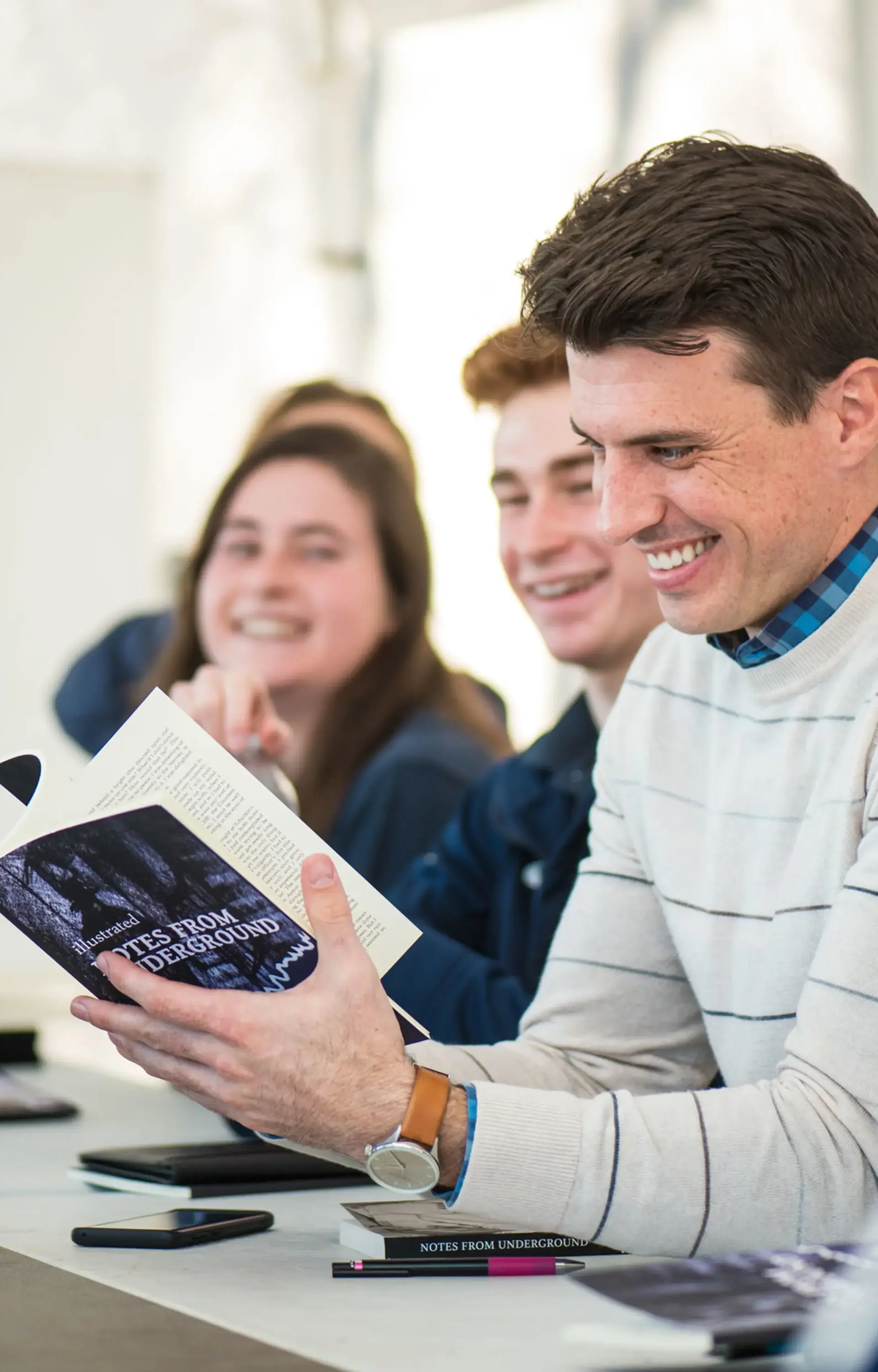 A teacher at The Cambridge School, a private Christian school in San Diego, leads a lively literature discussion on Dostoevsky’s Notes from Underground with upper school students.