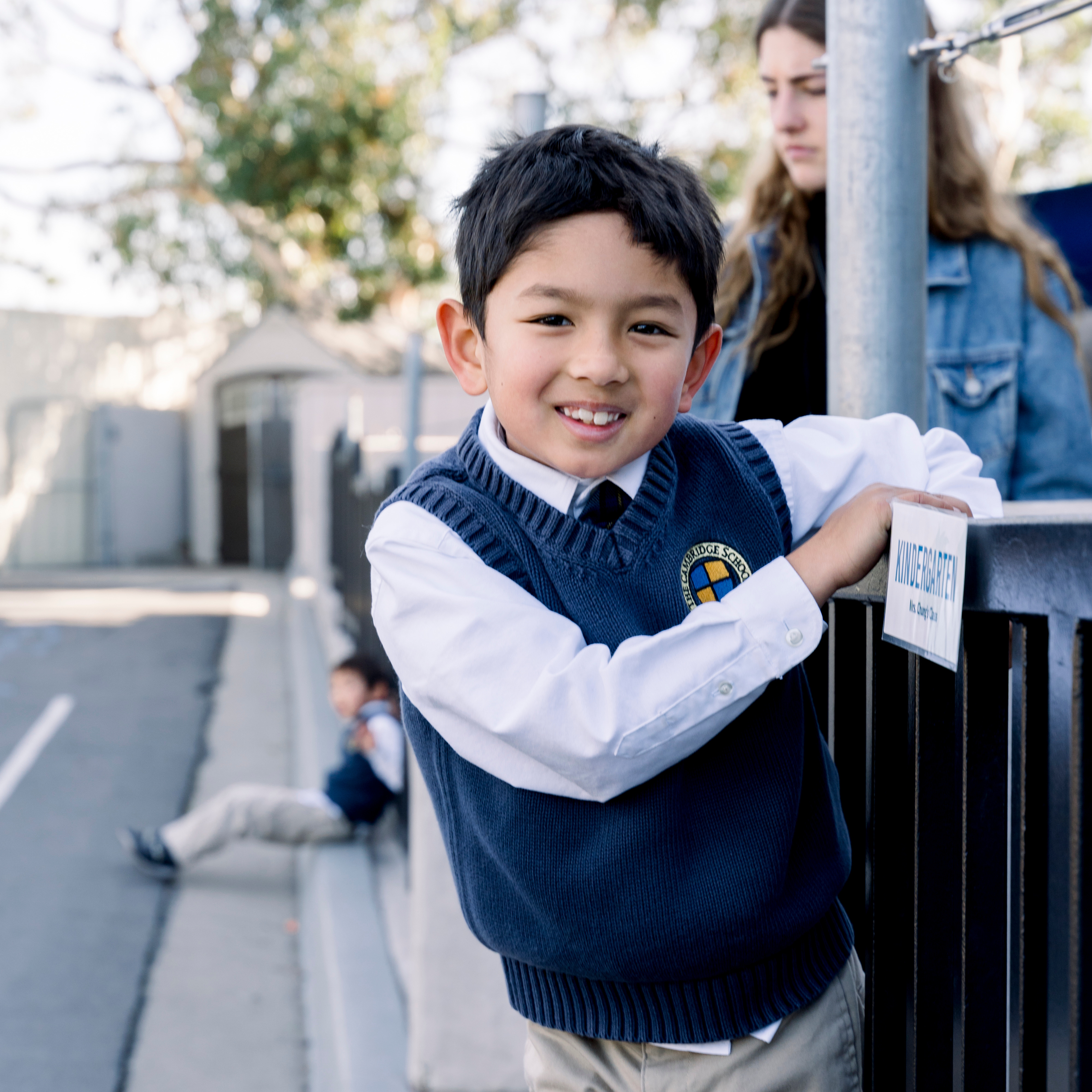 Kindergarten boy smiling before all school gathering