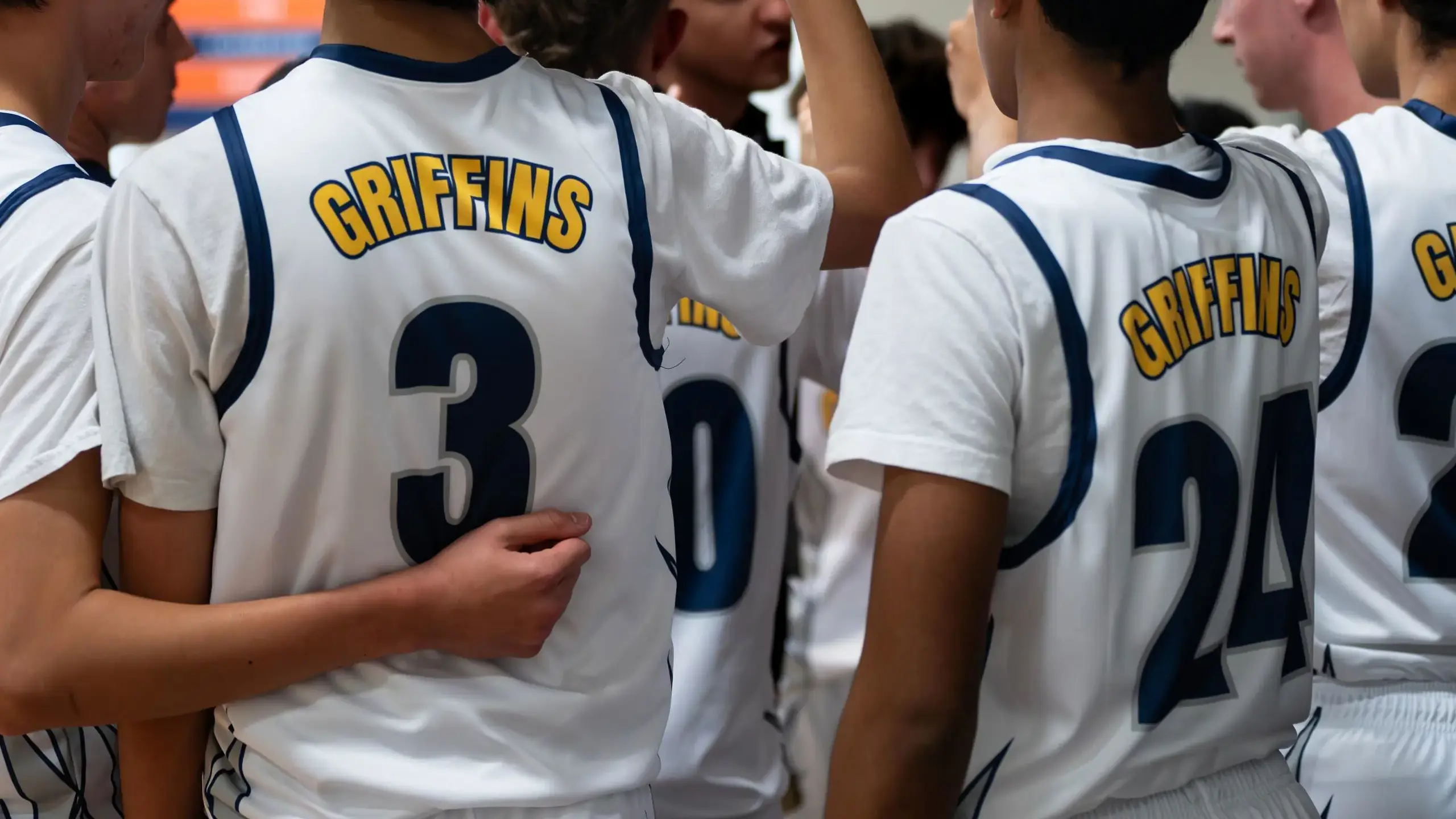 Student athletes in huddle
