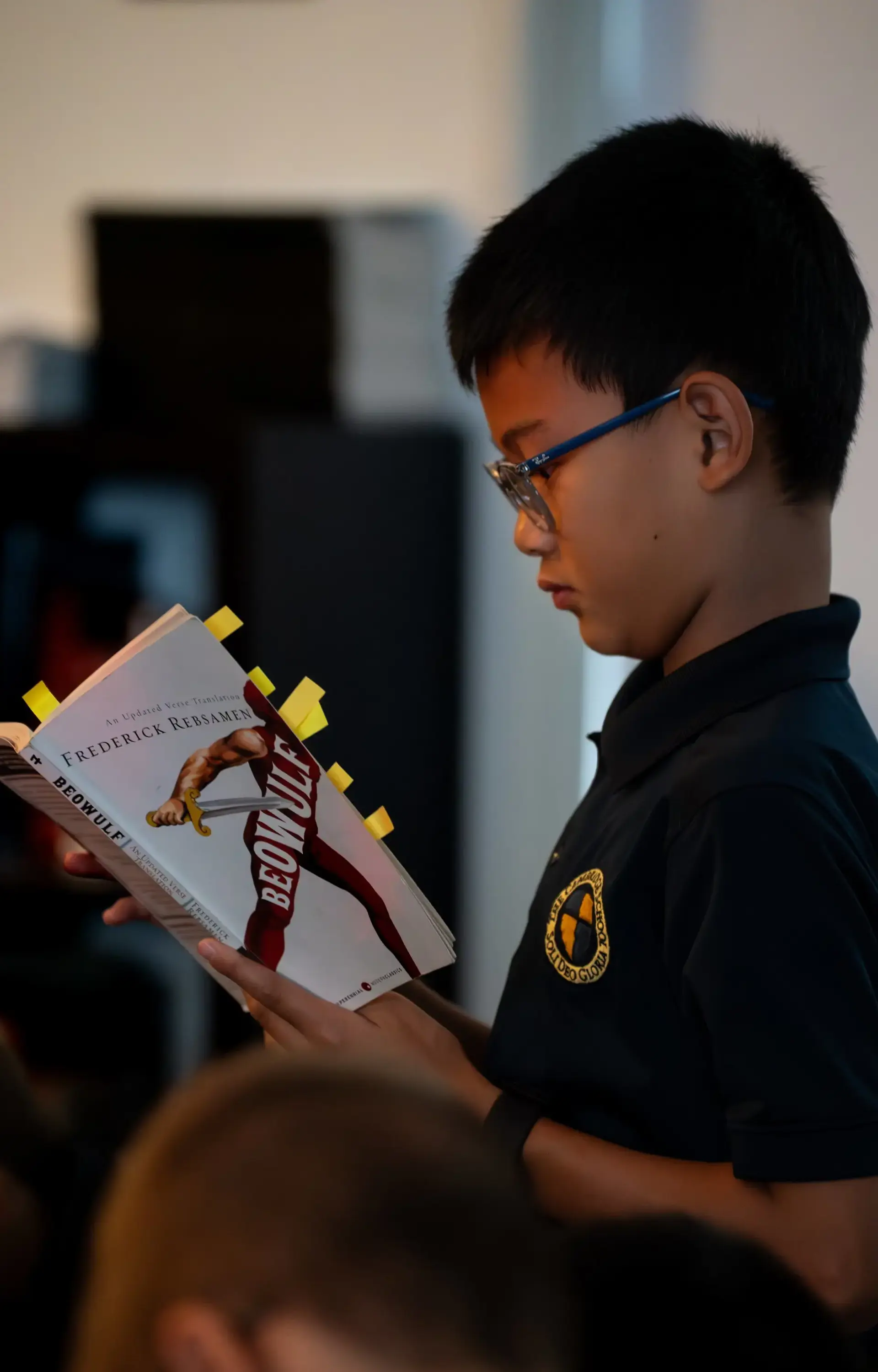 A student at The Cambridge School, a private Christian school in San Diego, reads Beowulf in class.