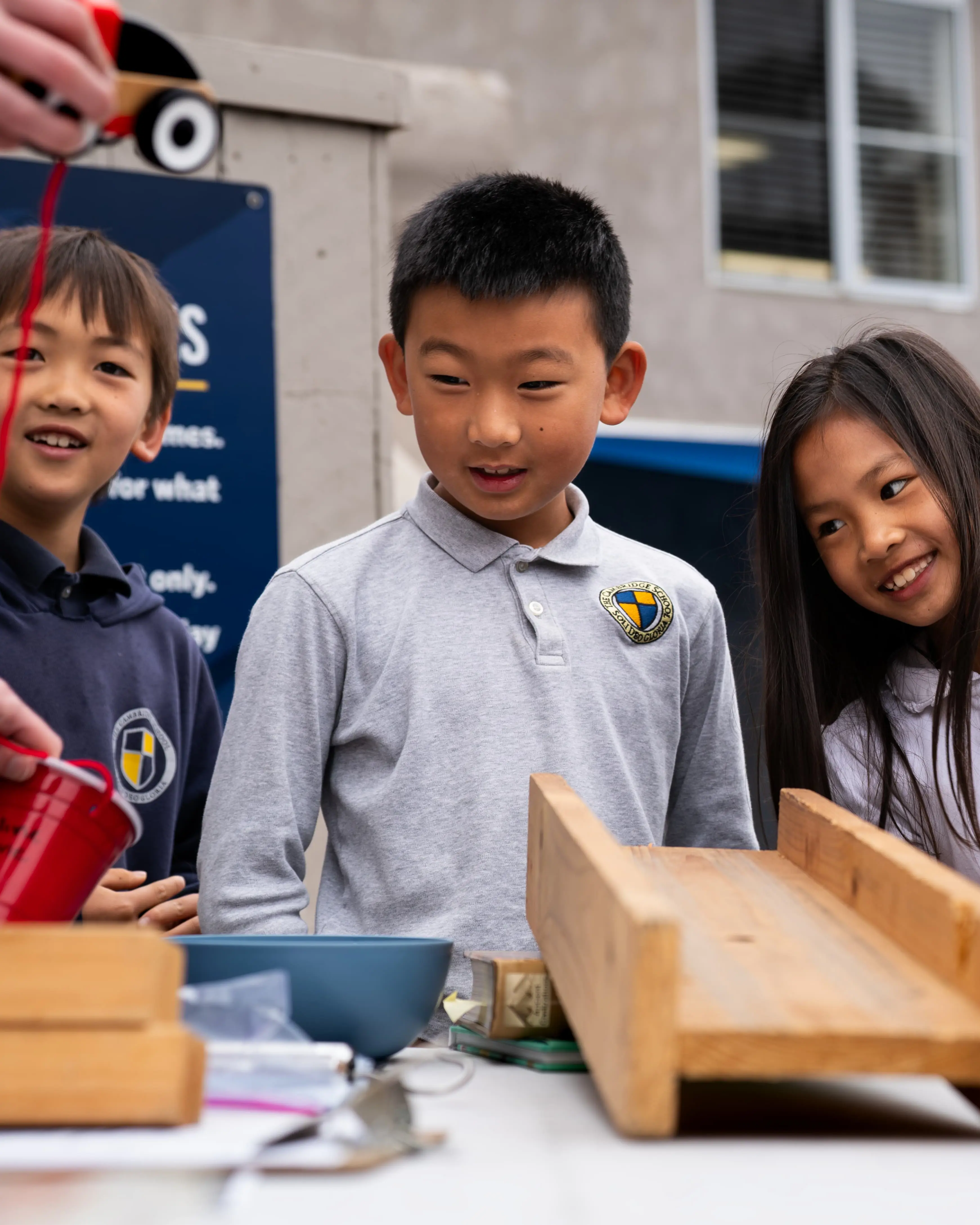 smiling students enjoying a science lesson about energy