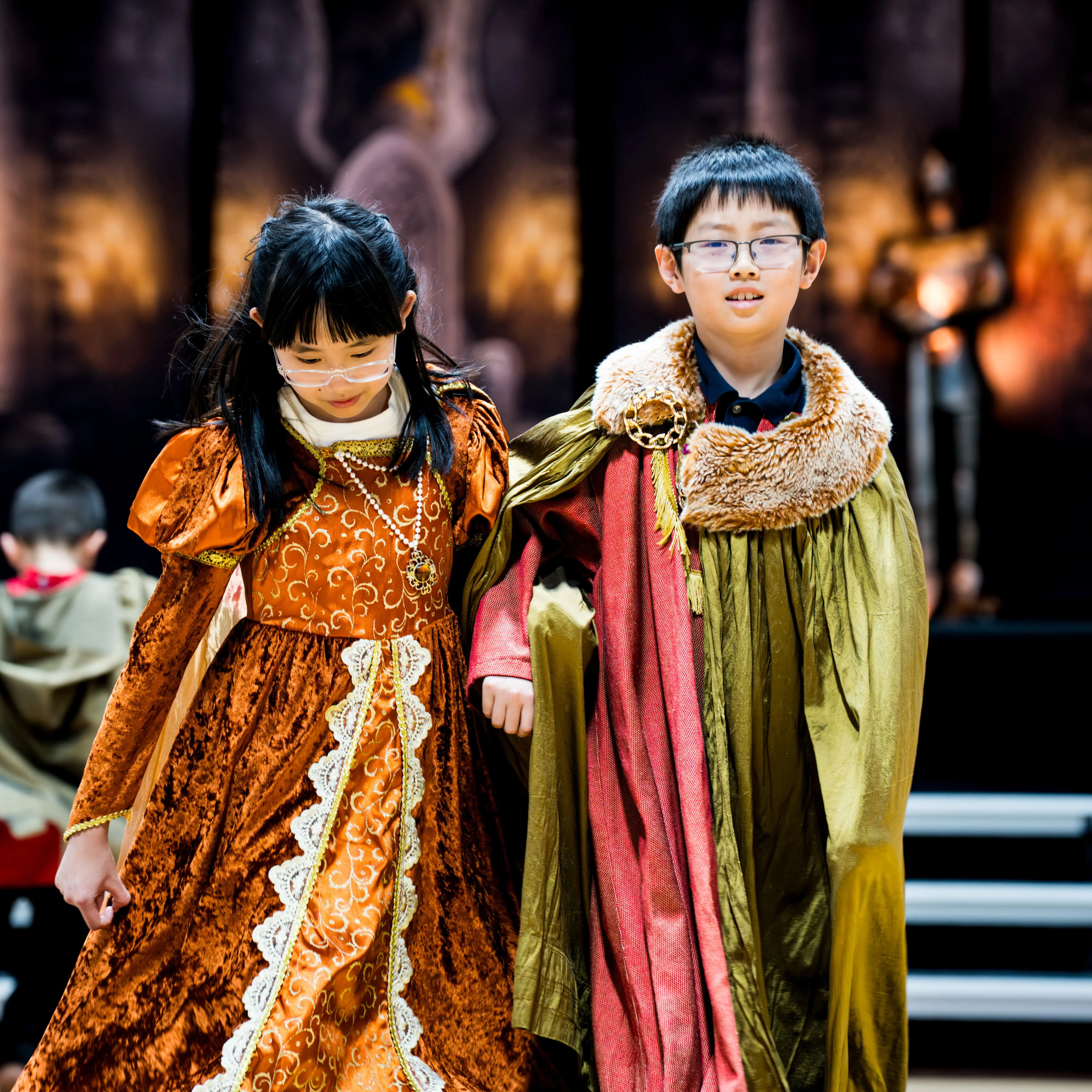 two students embody their learning during a feast day as they walk through history as part of a feast day at San Diego's top k-12 school. 