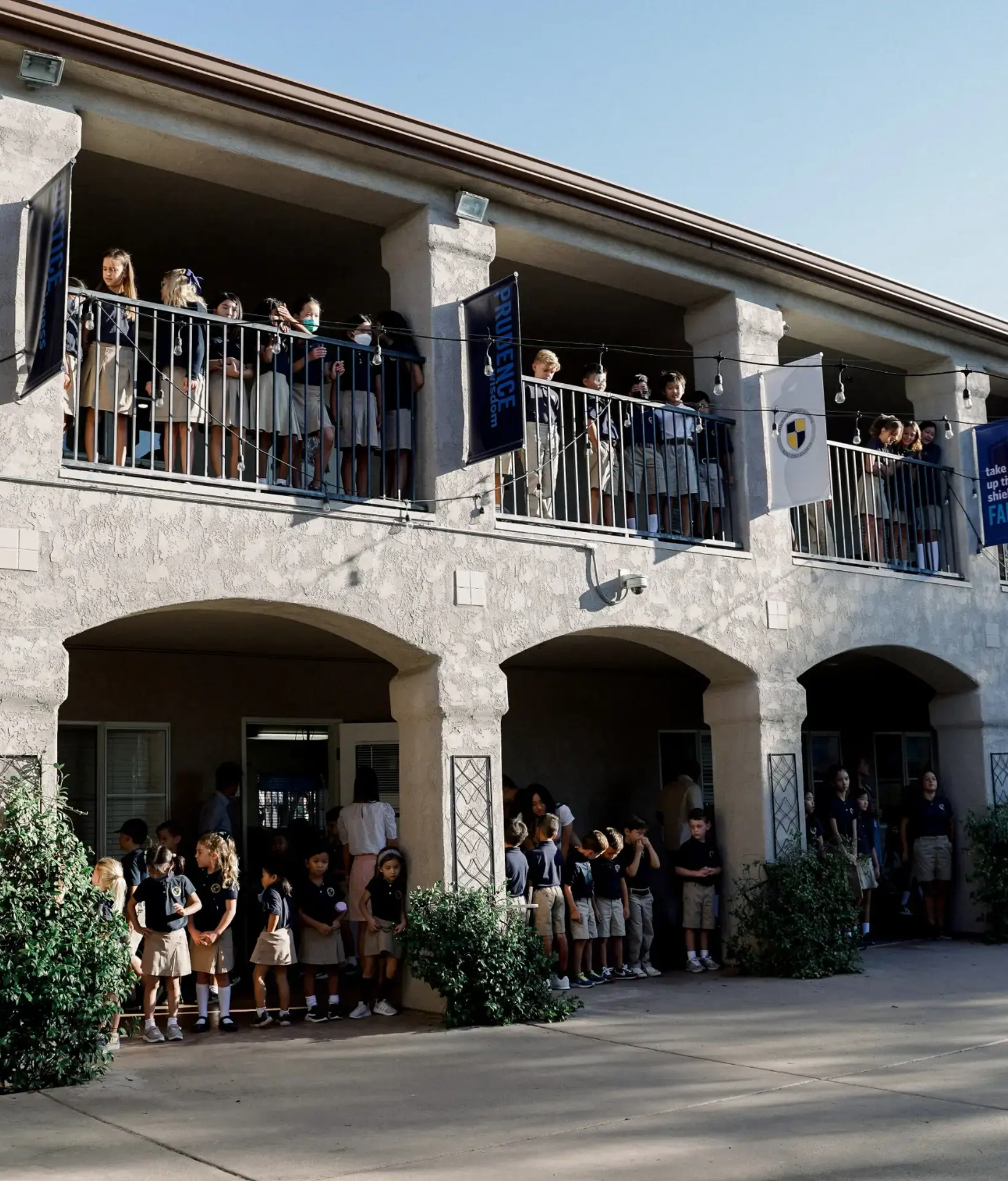 Students looking out from balconies