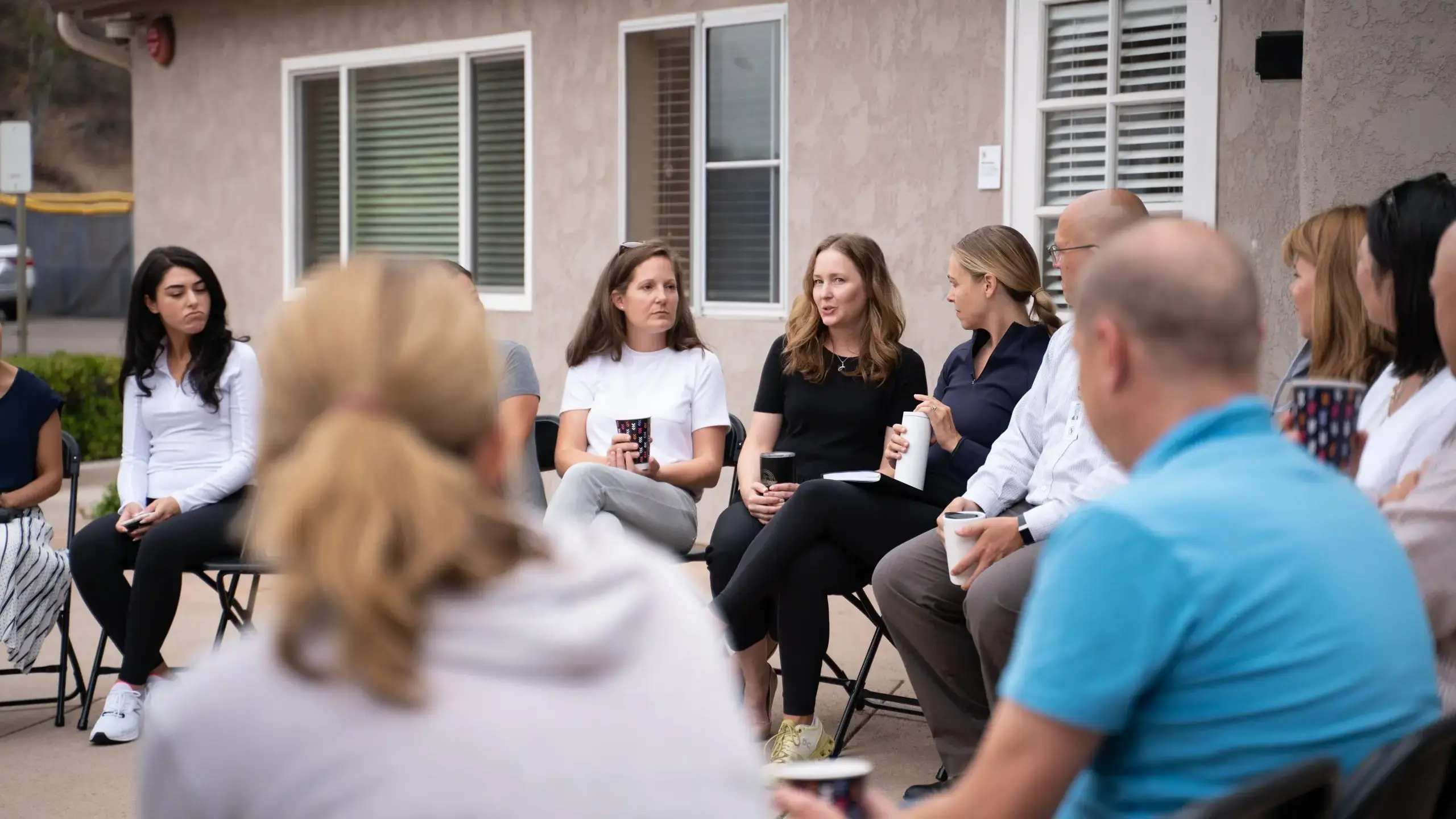 Parents sitting outside, having a discussion