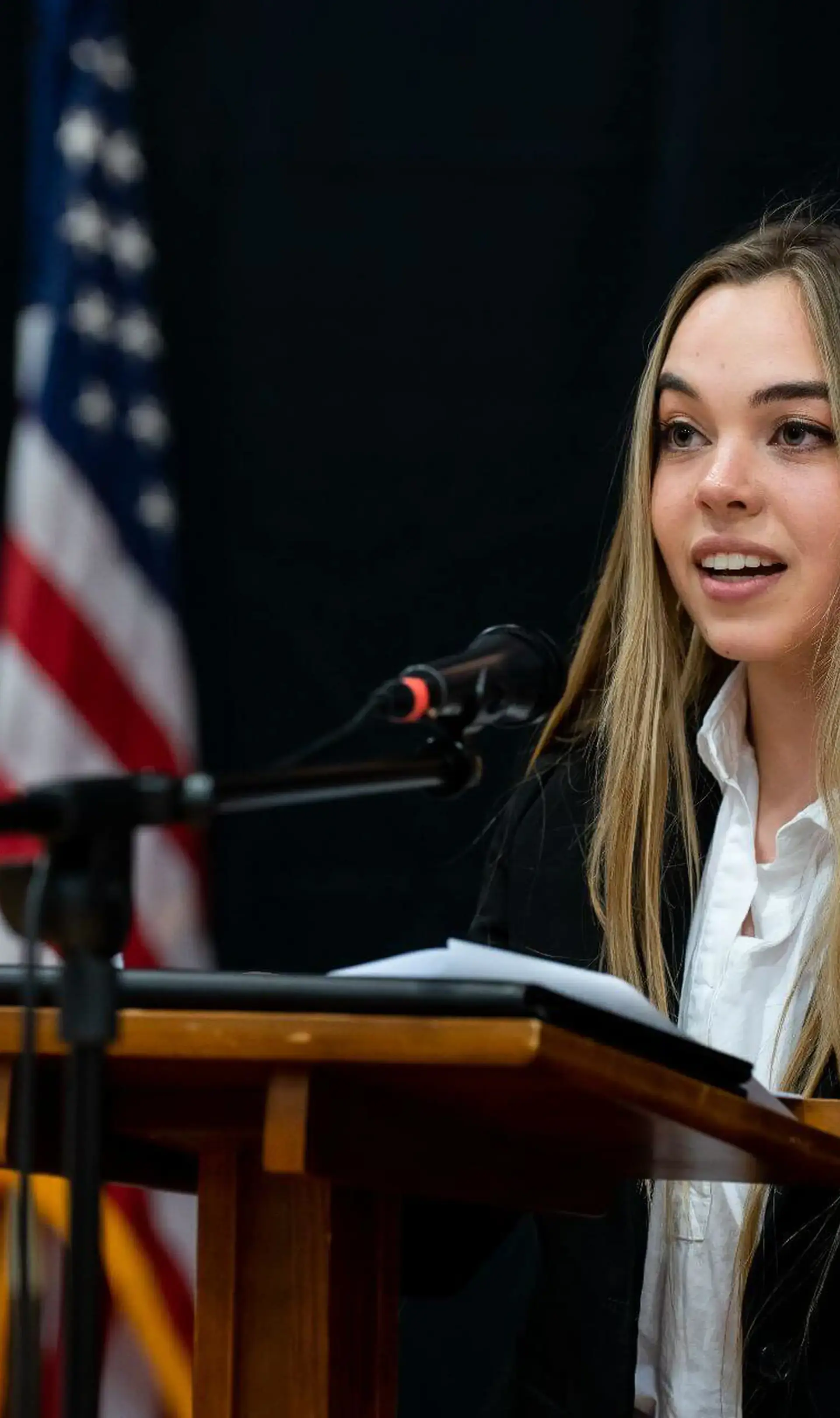 Student speaking at lecturn
