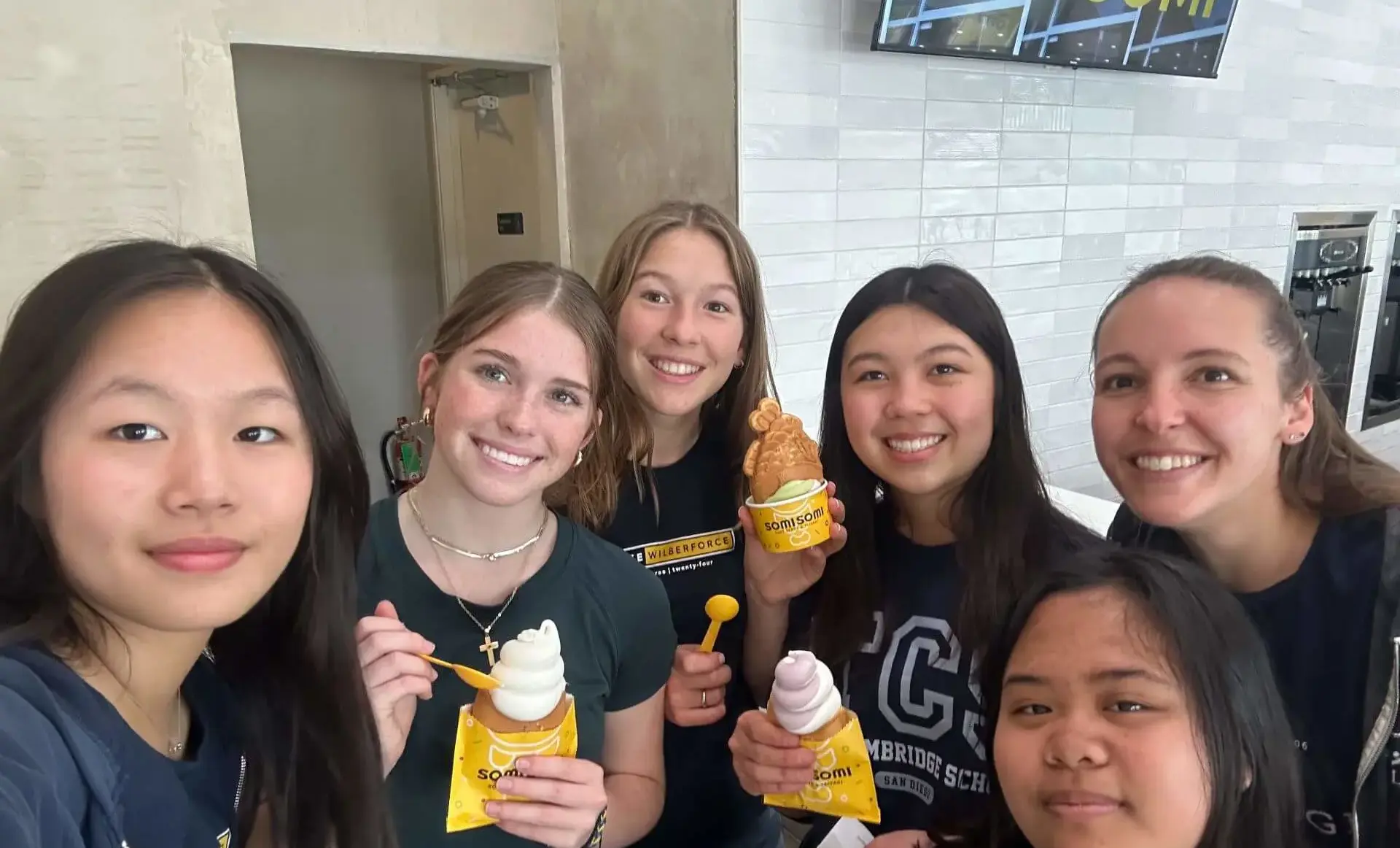Christian school students in San Diego enjoying community time with a faculty mentor—highlighting mentorship and relationship-building.