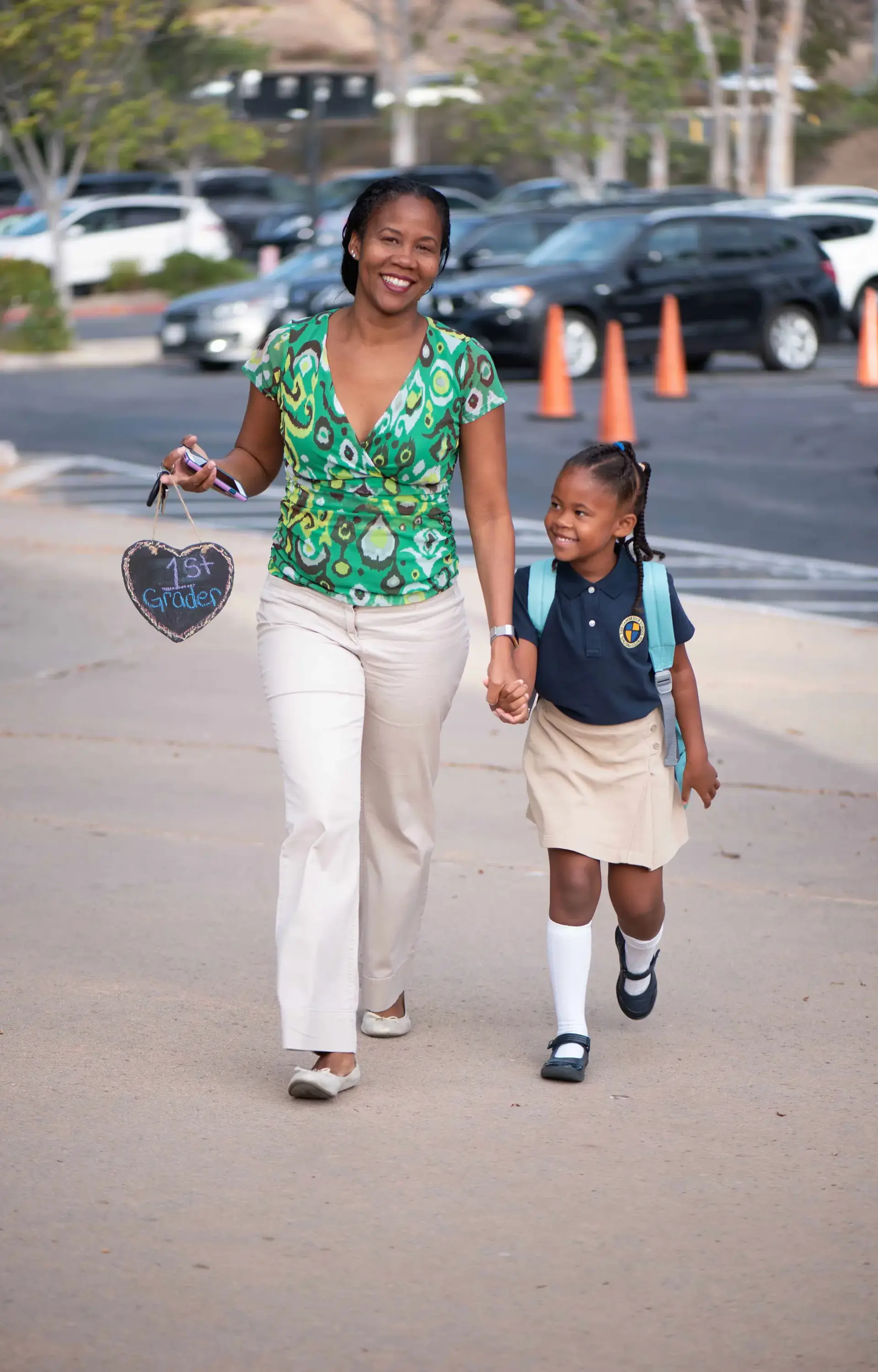 Parent and student walking to school hand in hand