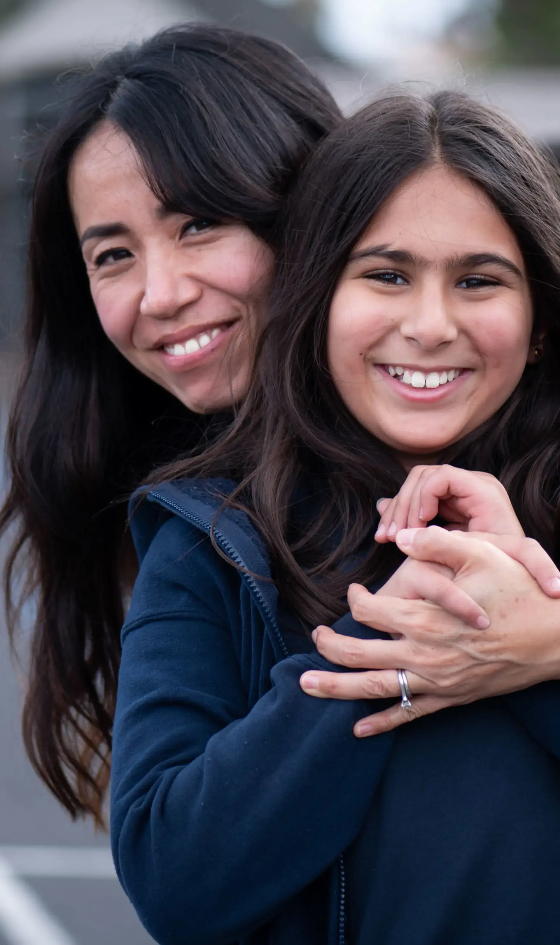 Two students embracing on the playground