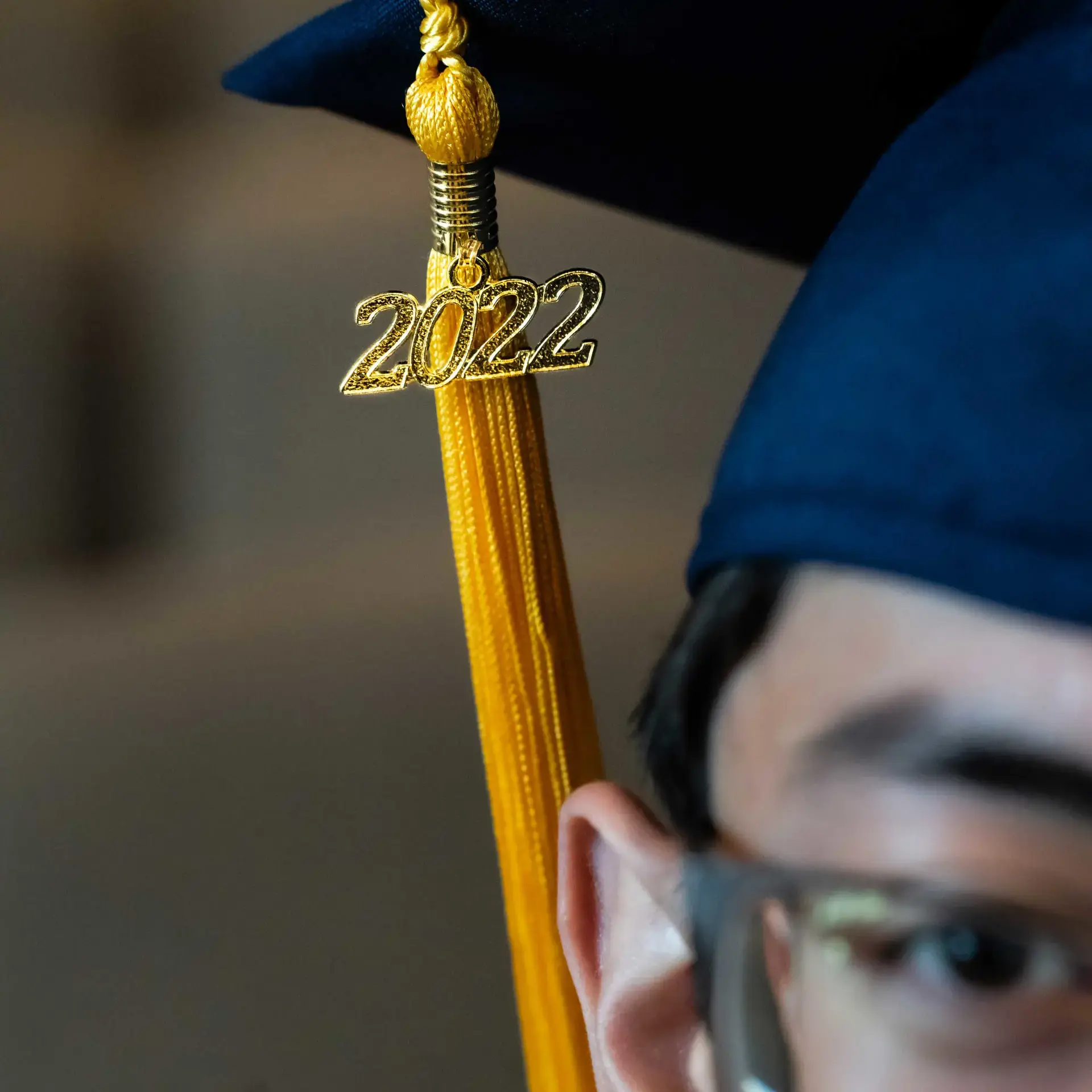 Close-up of student wearing graduation cap