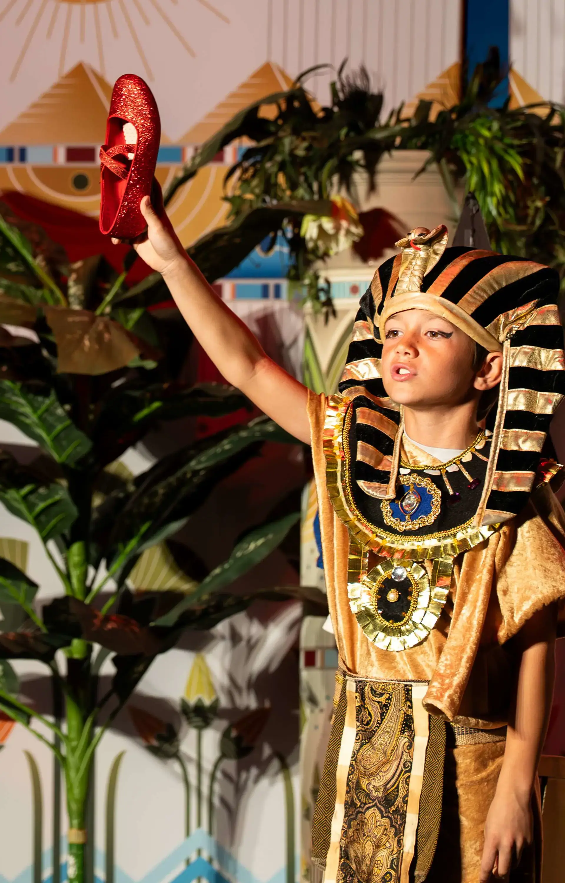 A grammar school student at The Cambridge School, a private Christian school in San Diego, performs a dramatic retelling of Rhodopis, the original Cinderella story set in ancient Egypt.