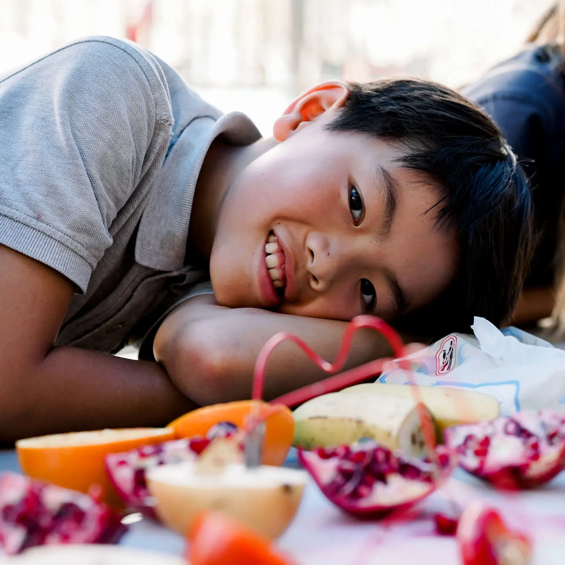 Student laying their head on a table of potpourri