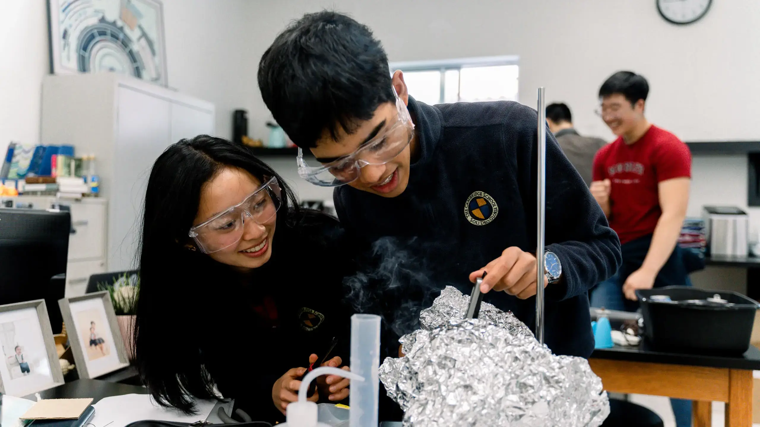 High school students at The Cambridge School, a private Christian school in San Diego, engage in a collaborative science experiment.