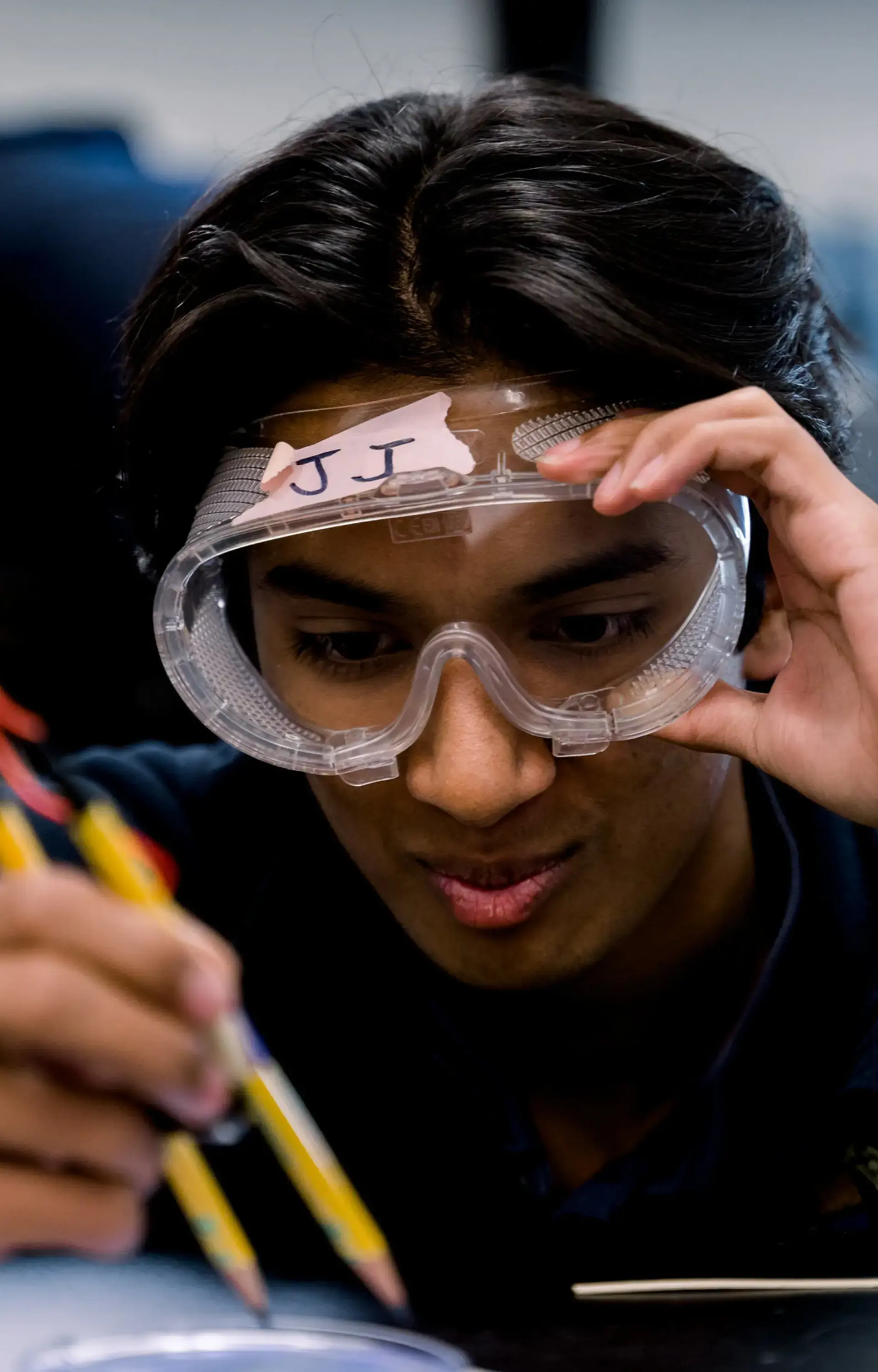 A high school student at The Cambridge School, a private Christian school in San Diego, engages in hands-on STEM learning.