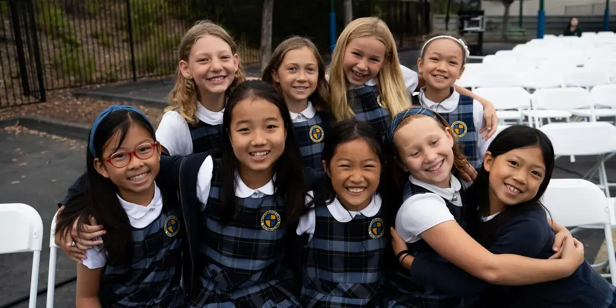 A group of young girls at The Cambridge School gather together for a photo during an all school event