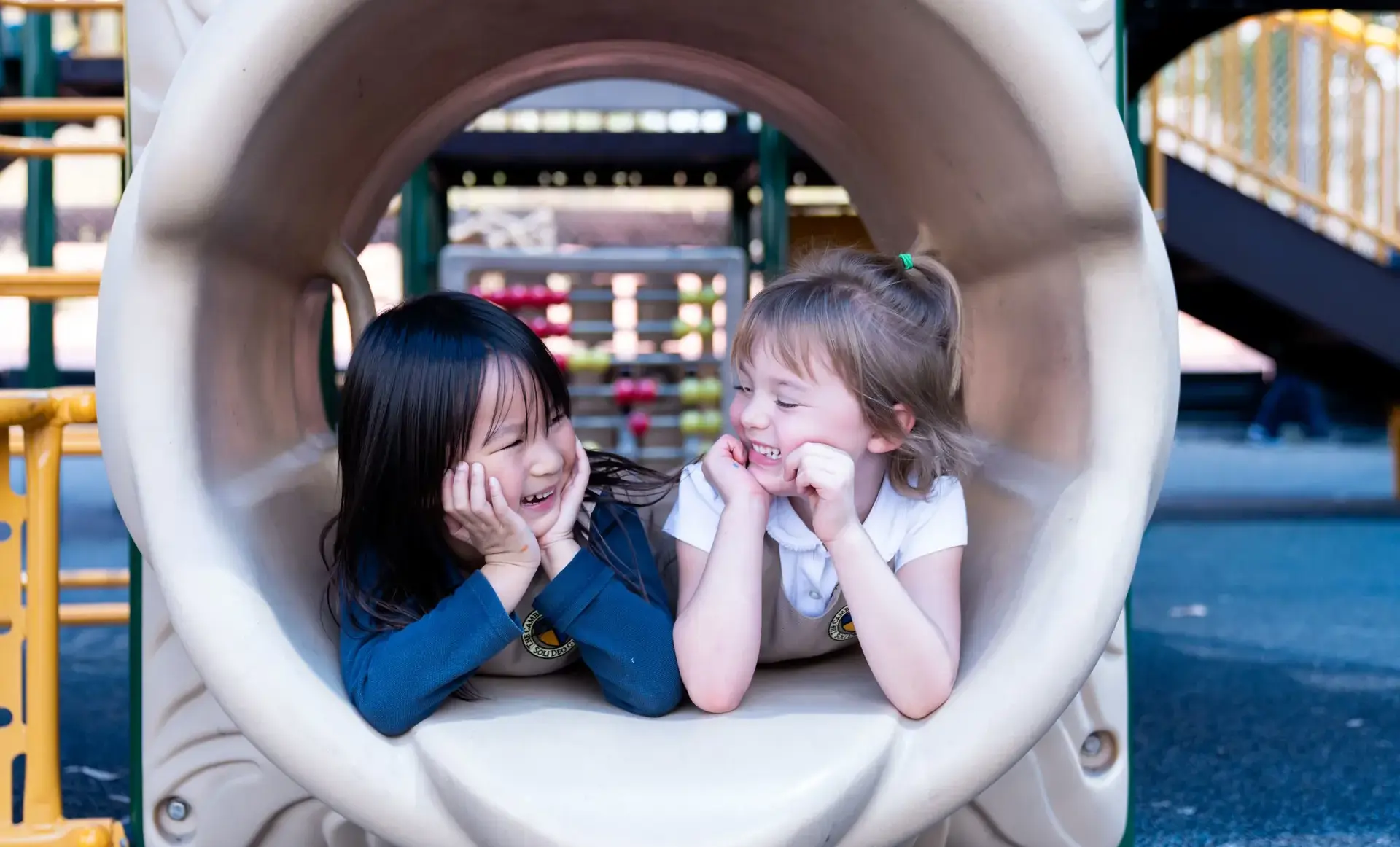 Two students looking at each other in a tunnel