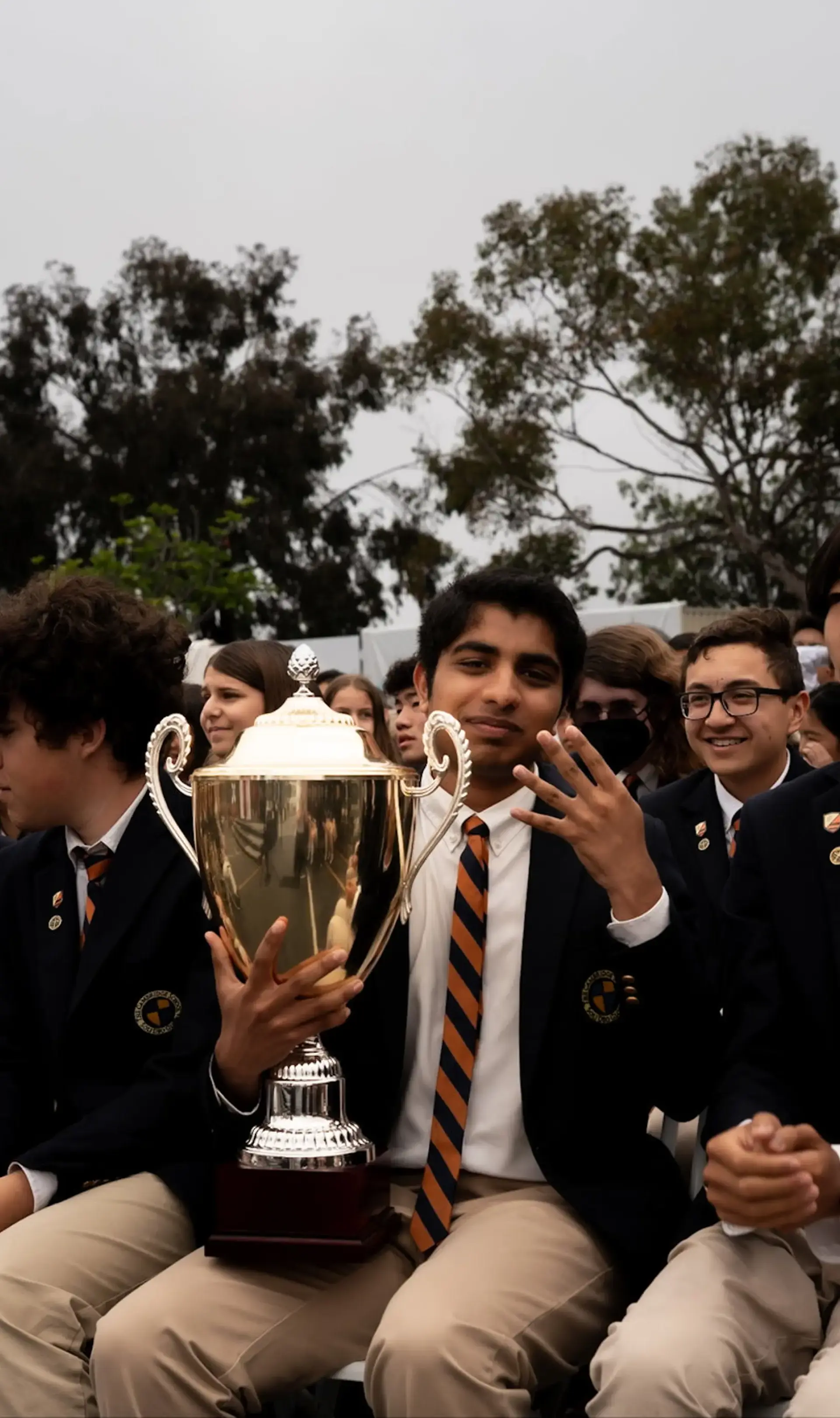 Student holding trophy