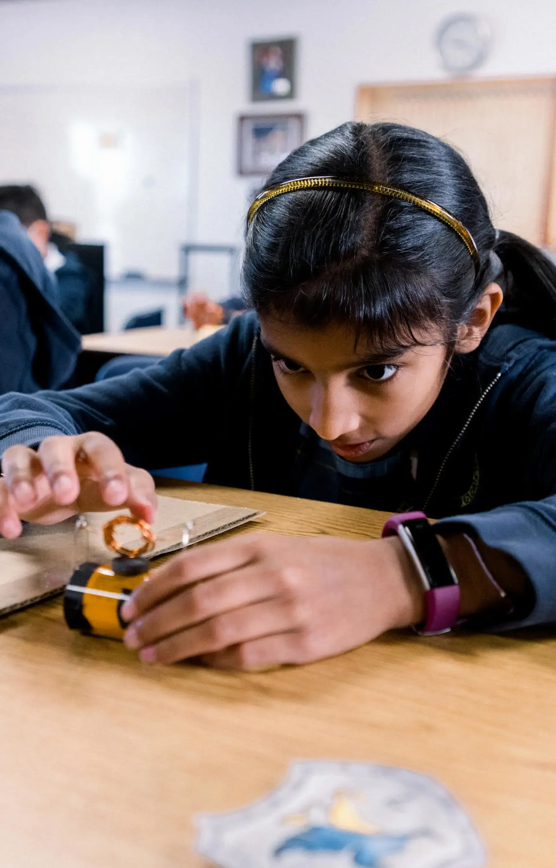 Elementary students at The Cambridge School, a private Christian school in San Diego, engage in a hands-on science activity.