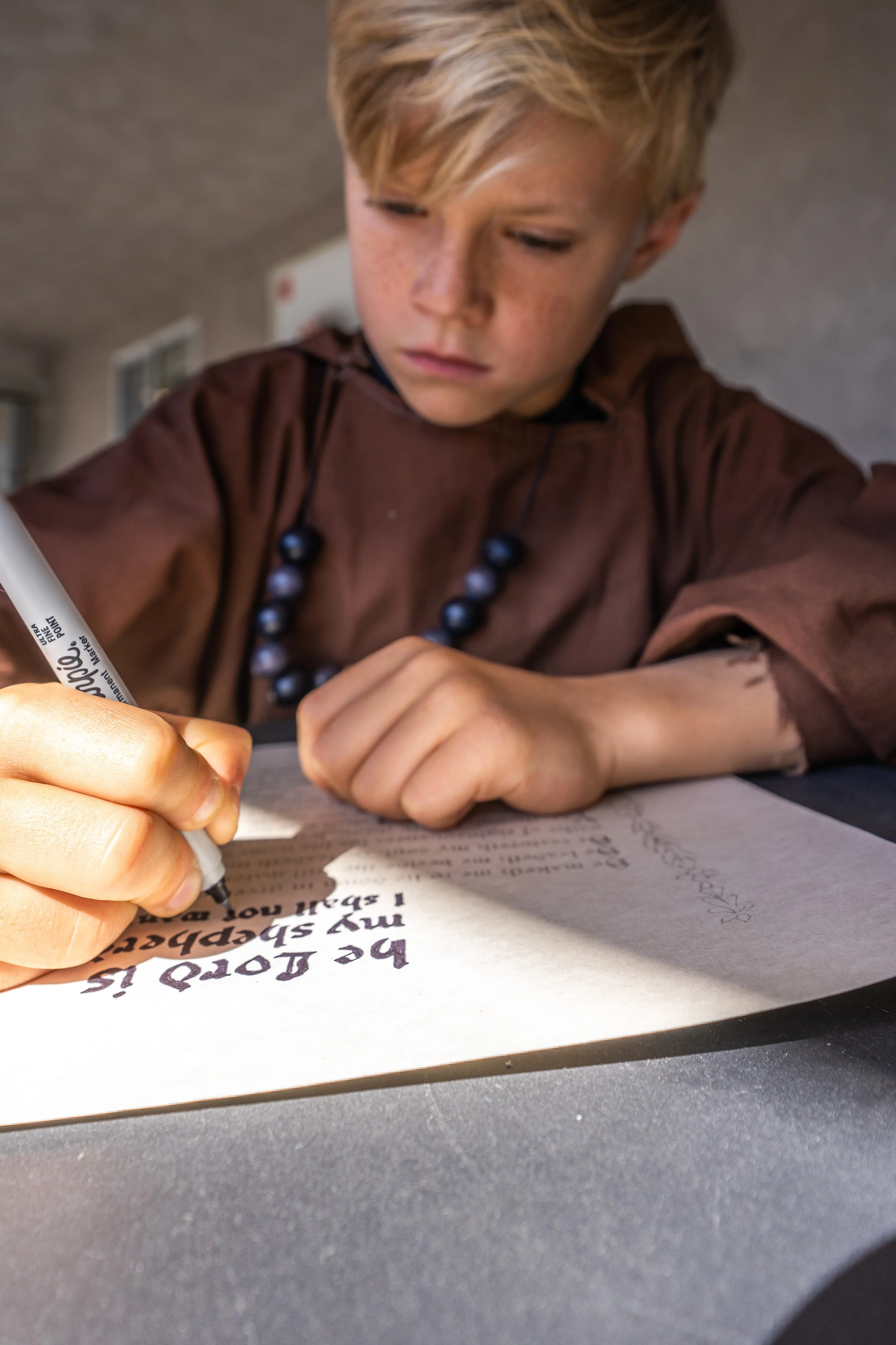 An Elementary School student at The Cambridge School in San Diego explores a monastic lifestyle through embodied learning during feast days.