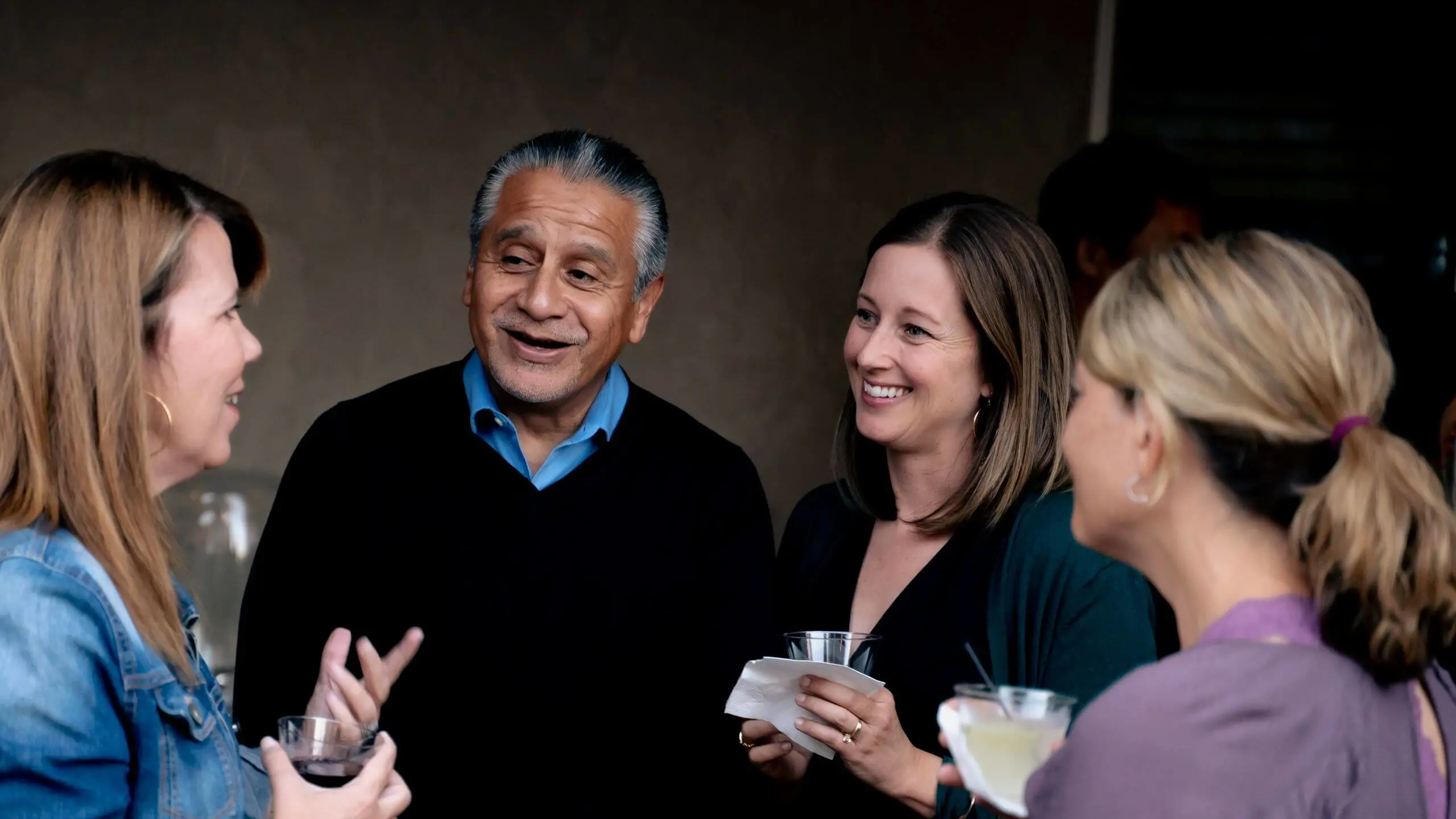 Parents from The Cambridge School, a private Christian school in San Diego, enjoying conversation and community at a school event.