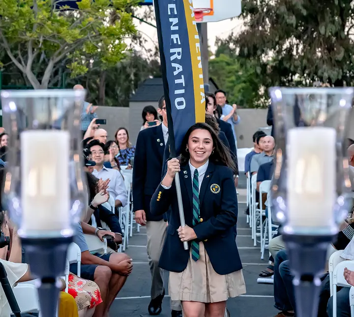 Student holding flag at opening convocation