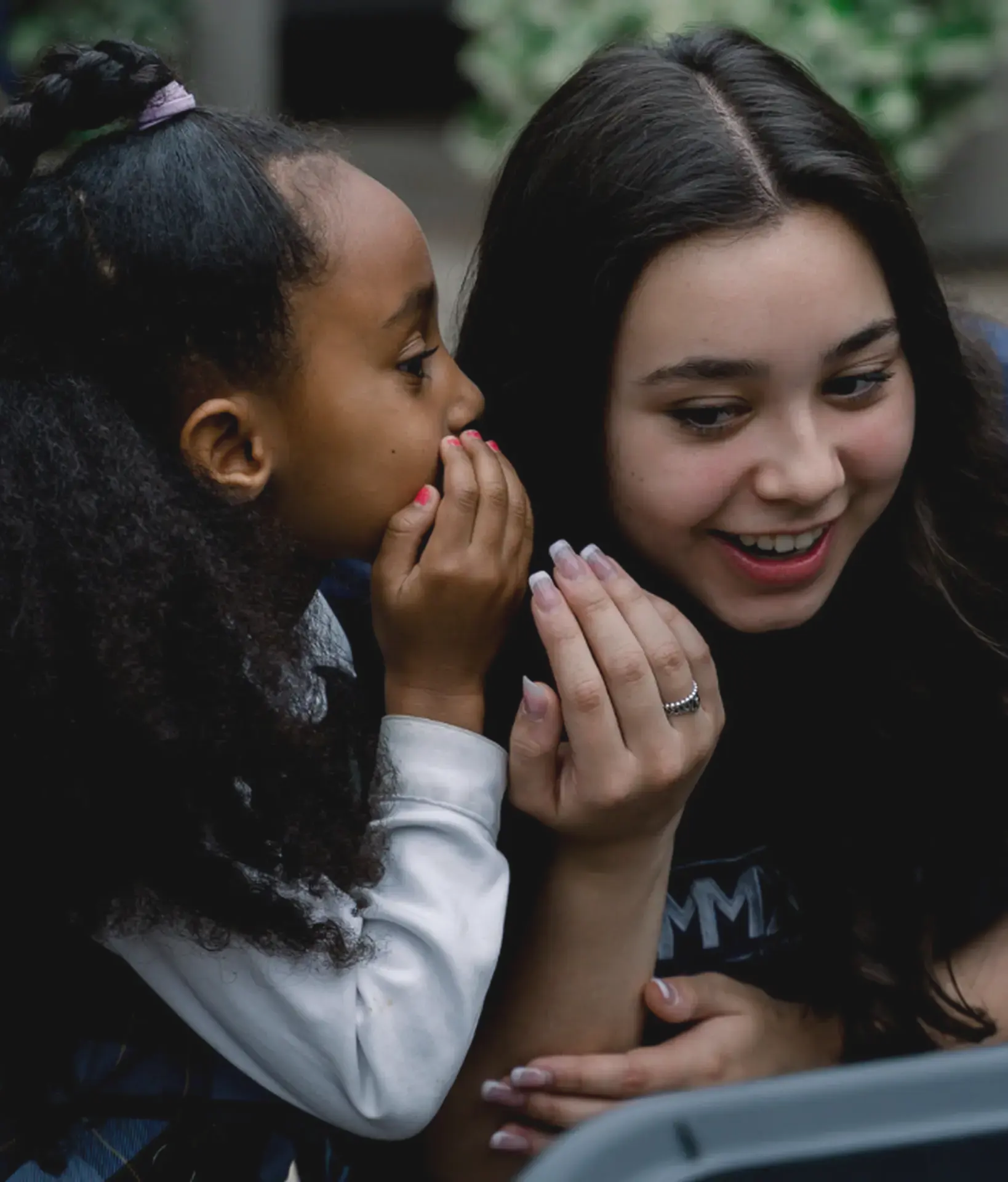 Students whispering to each other