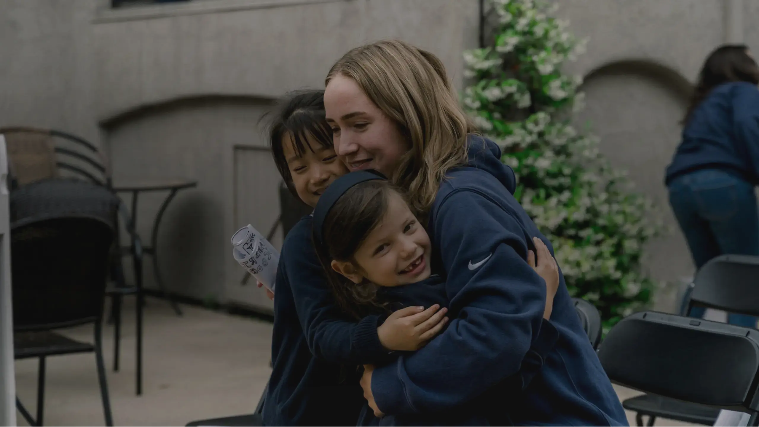Students embracing and smiling